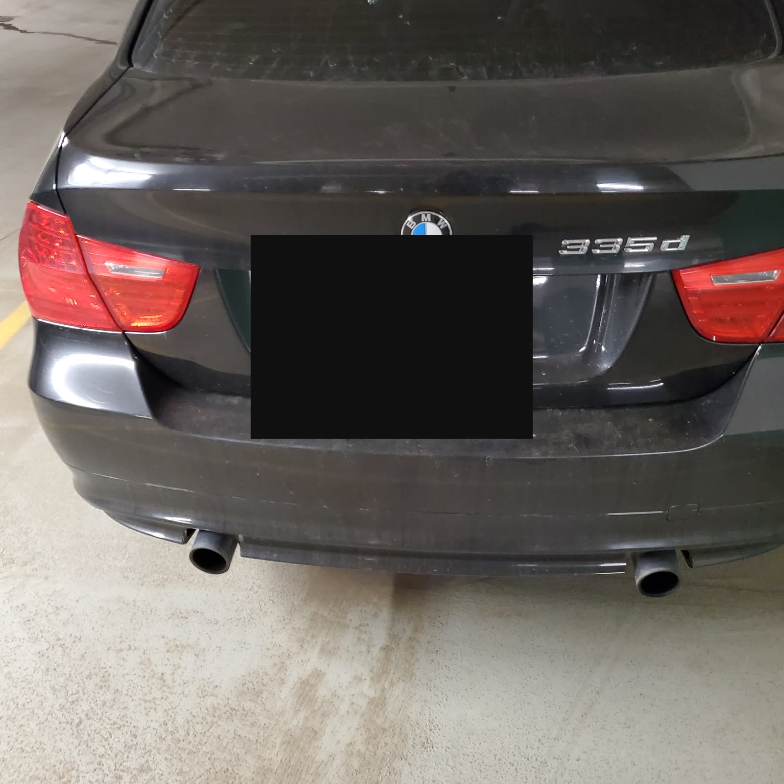 Betsy rear garage — plate redacted